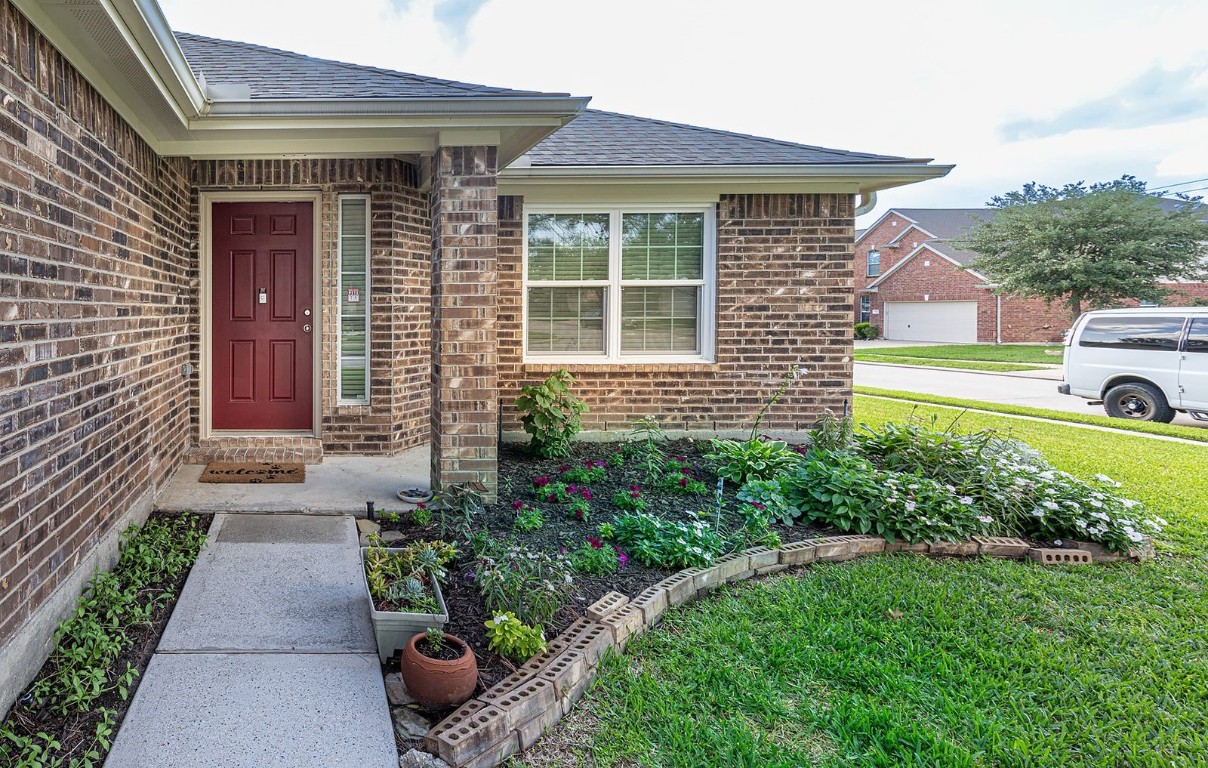22715 Imperial Ivy Court Spring, TX 77373 - Photo 5 of 45 a front view of a house with garden