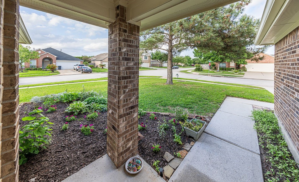 22715 Imperial Ivy Court Spring, TX 77373 - Photo 7 of 45 a view of a garden with a fountain