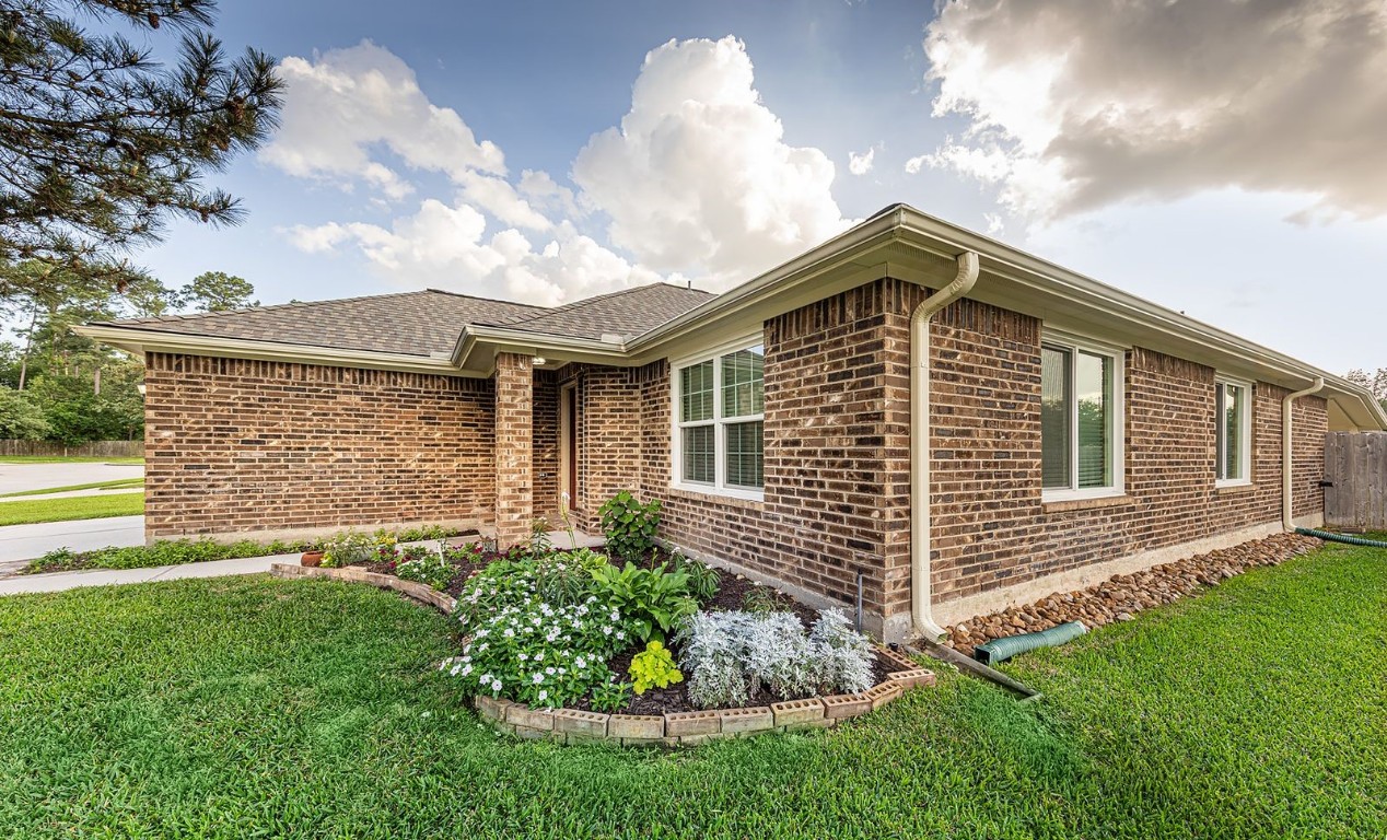 22715 Imperial Ivy Court Spring, TX 77373 - Photo 8 of 45 a front view of a house with a garden