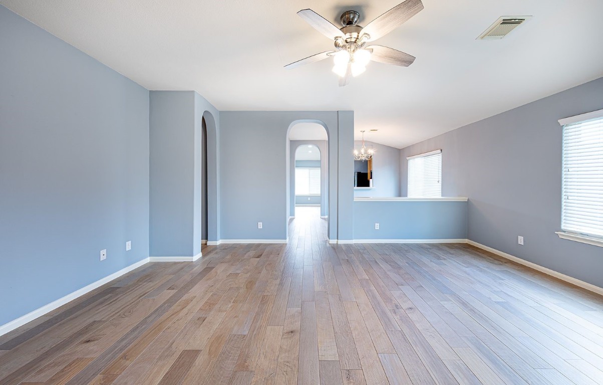 22715 Imperial Ivy Court Spring, TX 77373 - Photo 10 of 45 a view of an empty room with a window and wooden floor