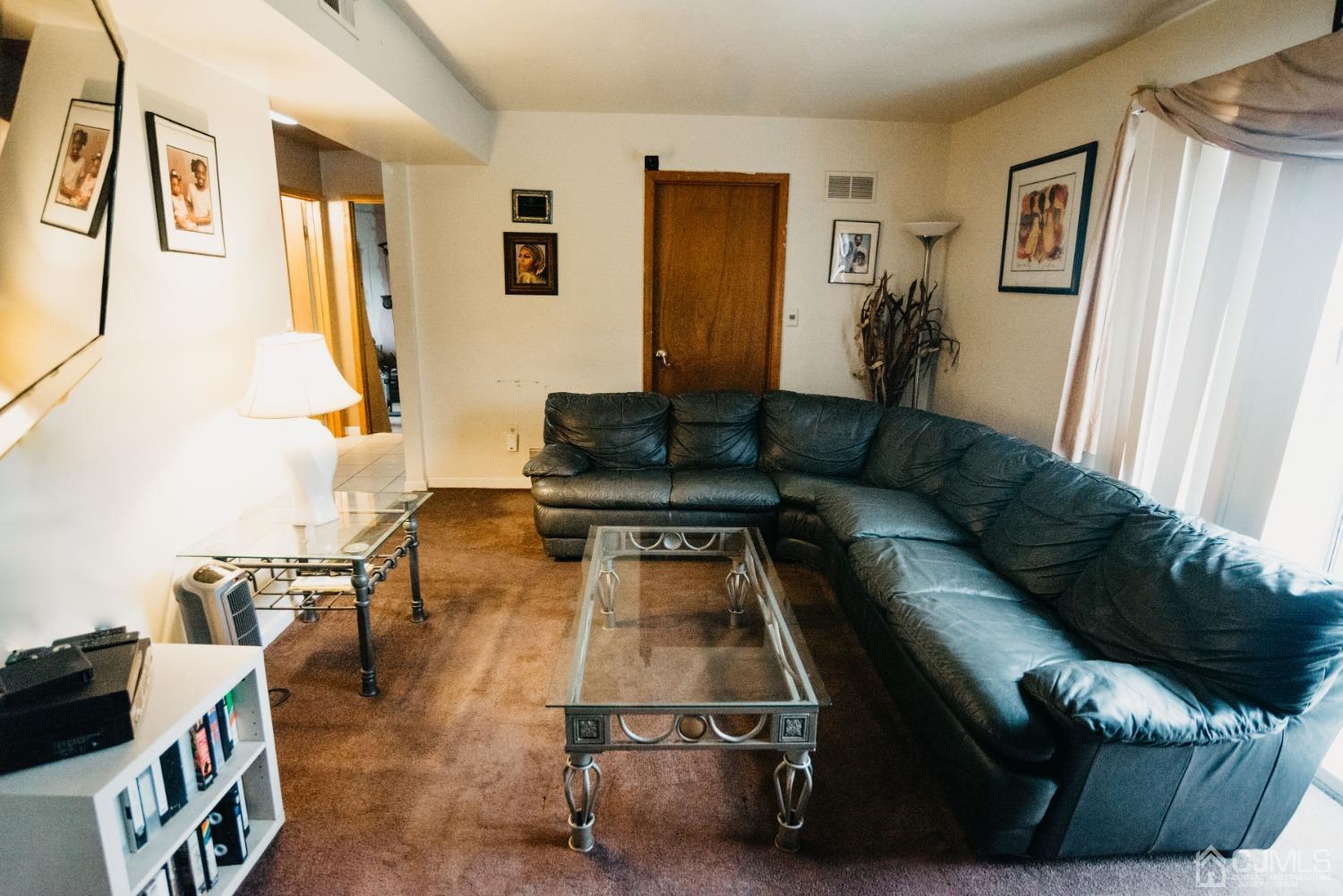 883 Inman Avenue Edison, NJ 08820 - Photo 7 of 7 a living room with furniture and a couch