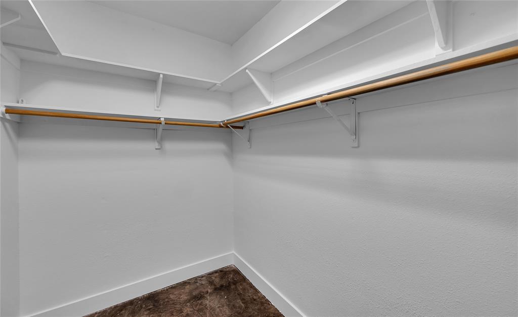 37 Bluebonnet Loop Morgan's Point Resort, TX 76513 - Photo 22 of 38 Walk-in closet featuring white walls, shelving, and clothes rods