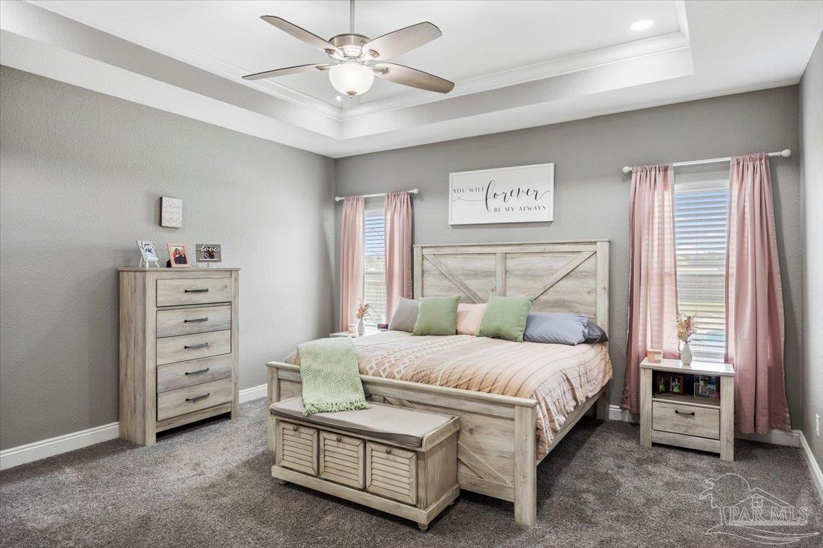 9258 Roy Cook Road Pace, FL 32571 - Photo 29 of 63 a bedroom with a bed and a window