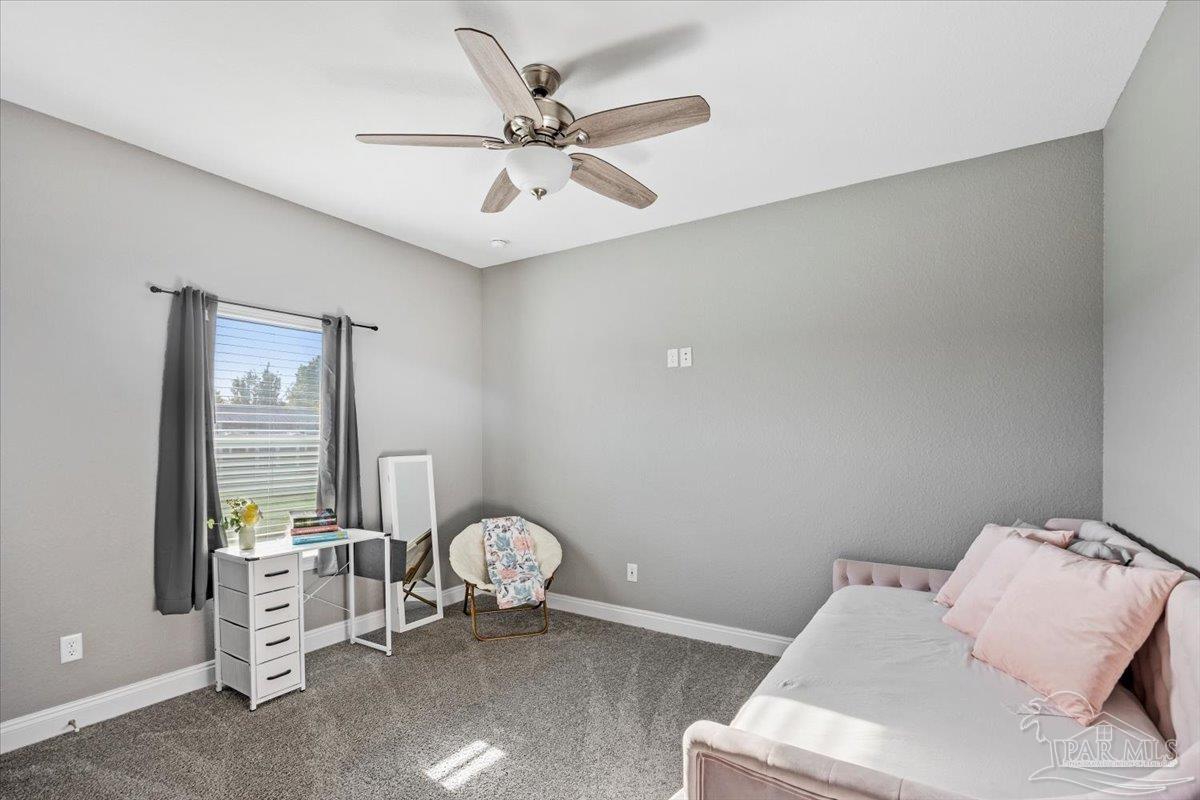 9258 Roy Cook Road Pace, FL 32571 - Photo 43 of 63 a living room with furniture and white walls