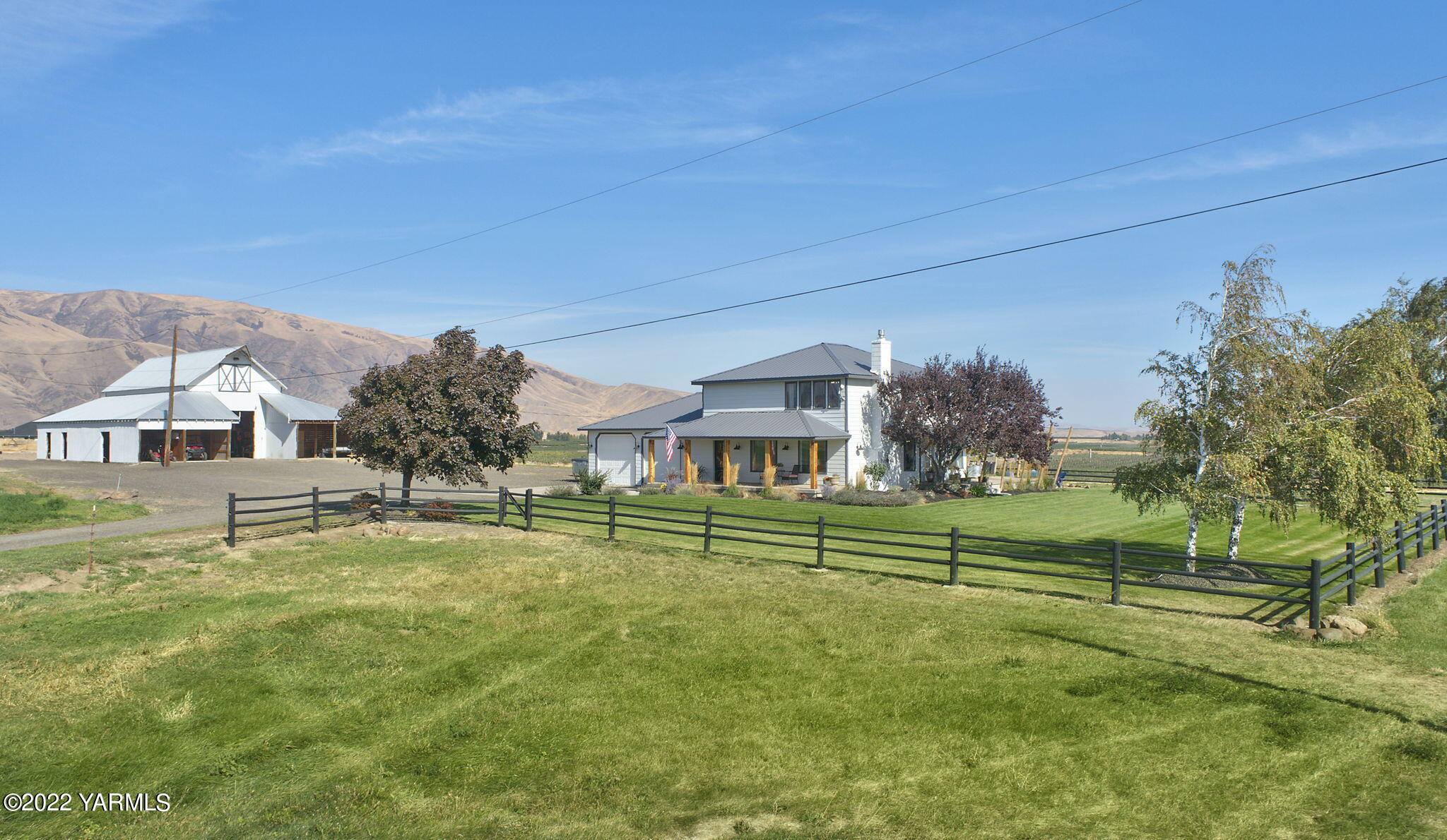 341 Section 1 Road Tieton, WA 98947 - Photo 1 of 44 a view of a big house in a big yard with large trees