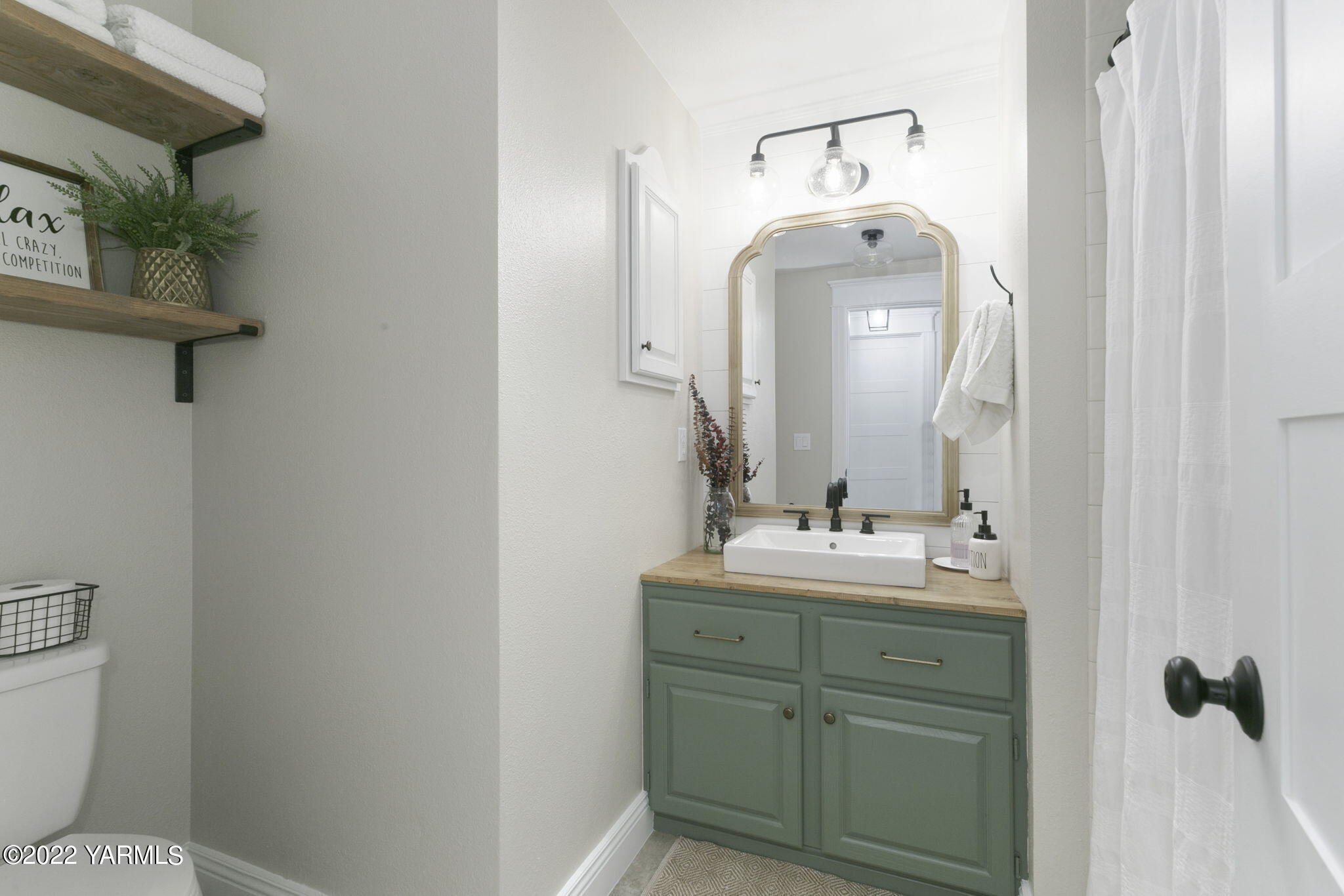 341 Section 1 Road Tieton, WA 98947 - Photo 15 of 44 a bathroom with a toilet sink and mirror