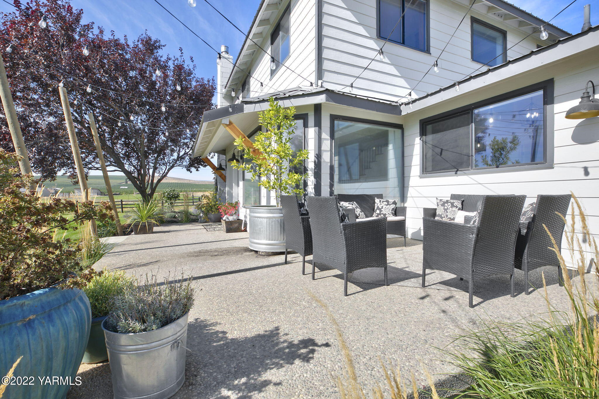 341 Section 1 Road Tieton, WA 98947 - Photo 26 of 44 a view of a patio with chairs and plants