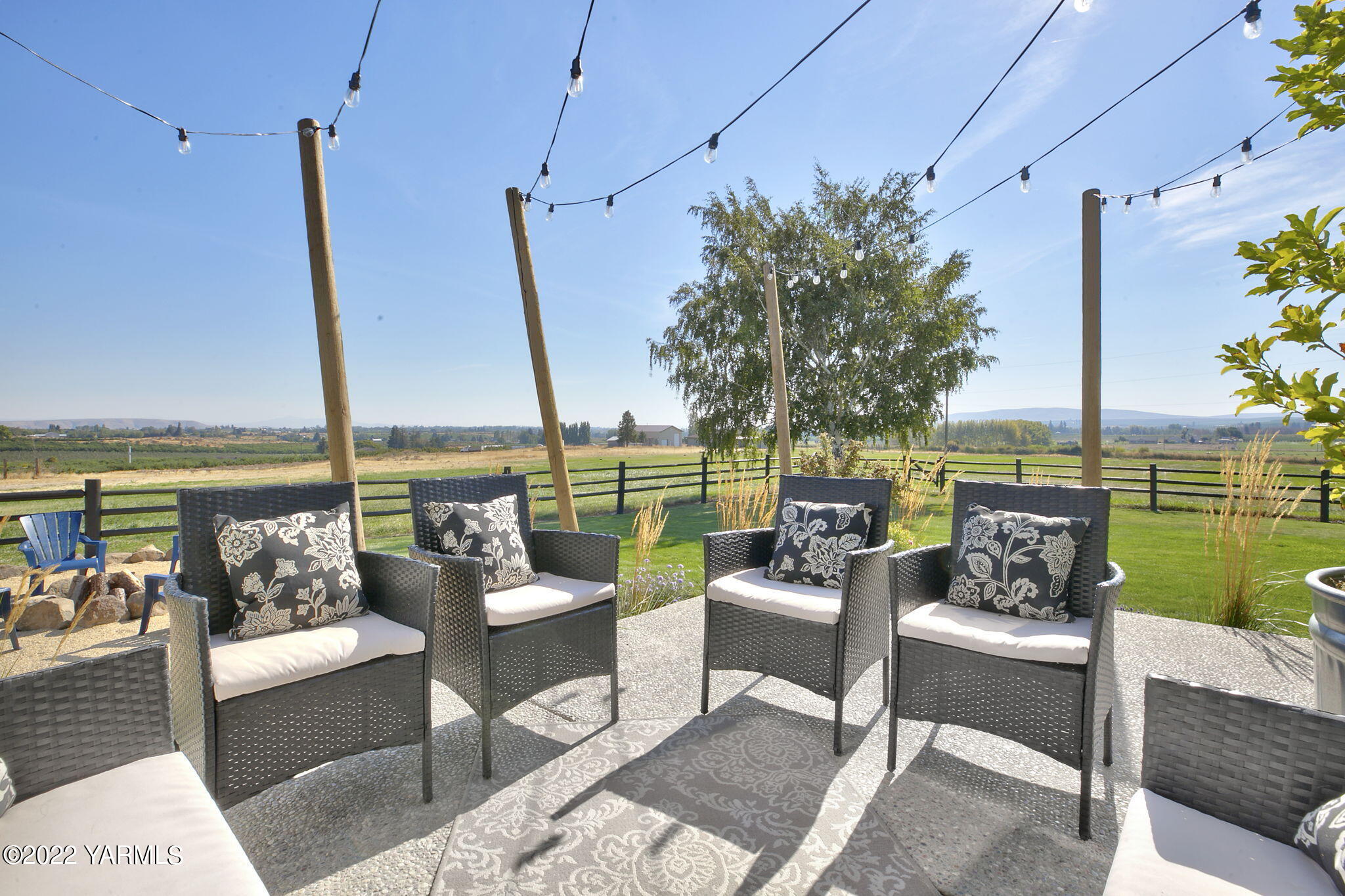 341 Section 1 Road Tieton, WA 98947 - Photo 27 of 44 a view of a patio with couches potted plants and ocean view