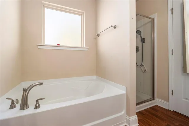 a white bath tub sitting next to a window