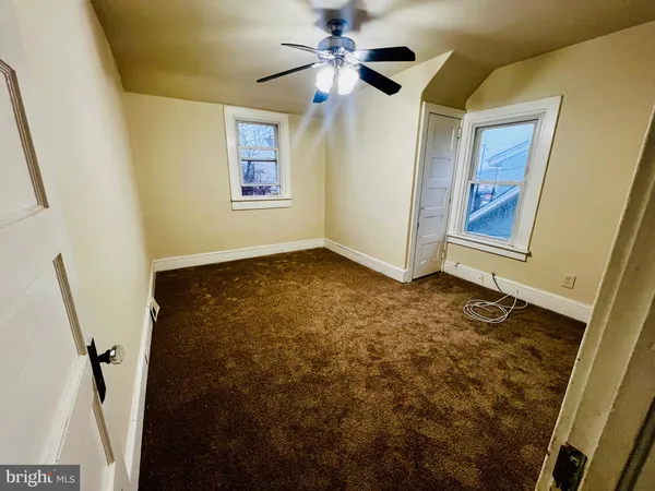 a balcony with wooden floor and outdoor space