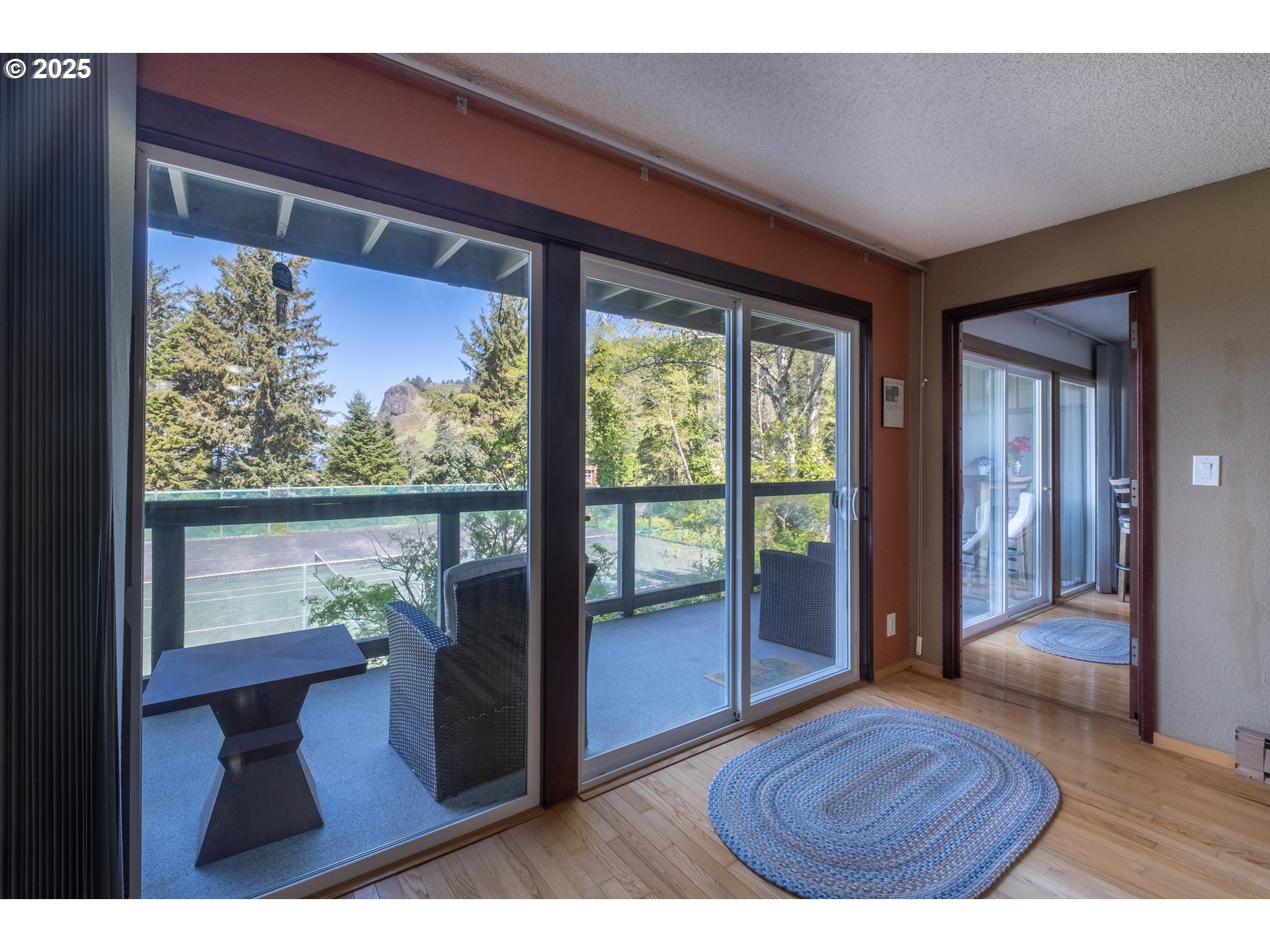301 Otter Crest Loop, Unit 174/175 Otter Rock, OR 97369 - Photo 13 of 46 a living room with furniture and a floor to ceiling window