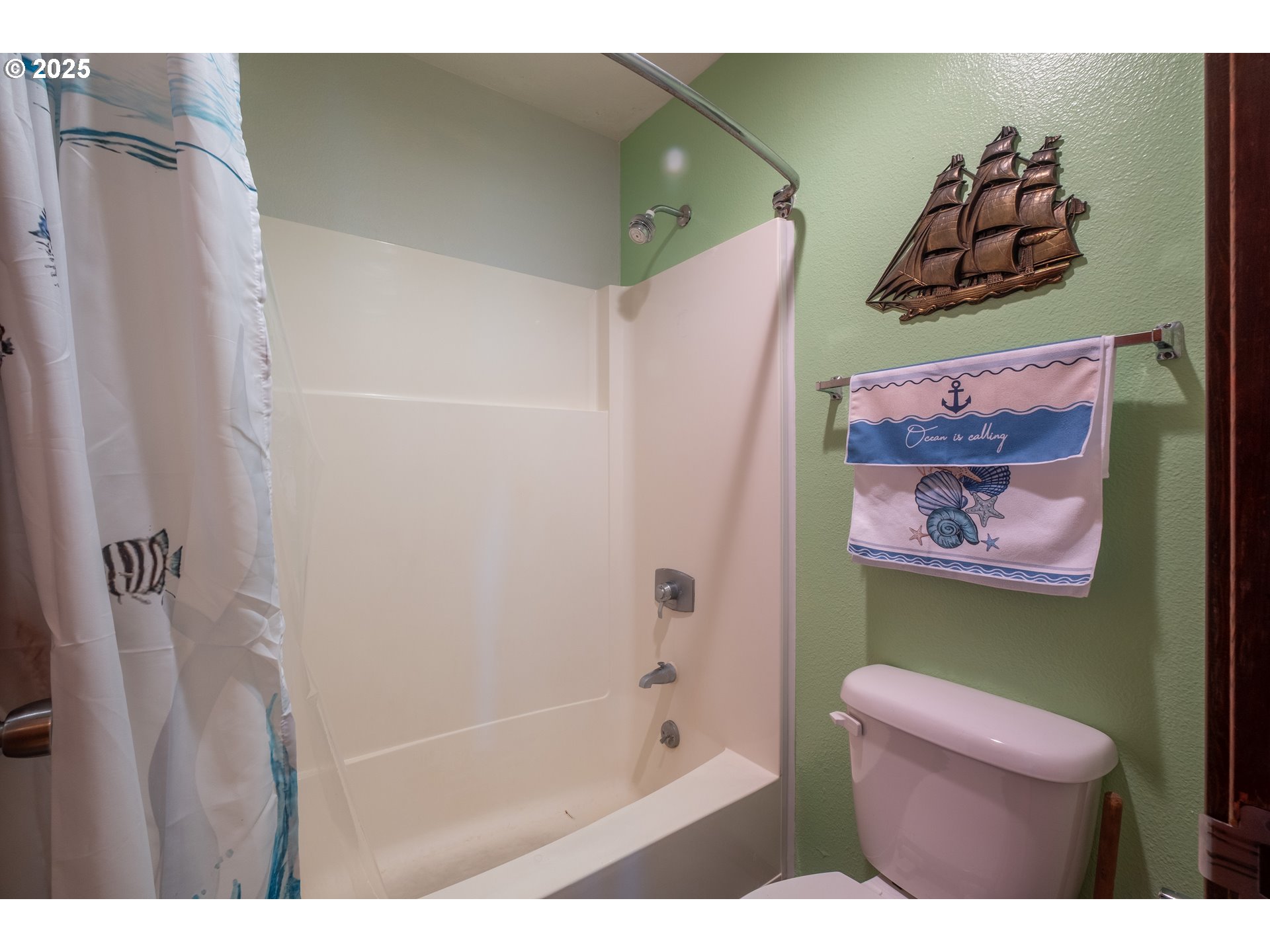 301 Otter Crest Loop, Unit 174/175 Otter Rock, OR 97369 - Photo 19 of 46 a bathroom with a bathtub and a shower