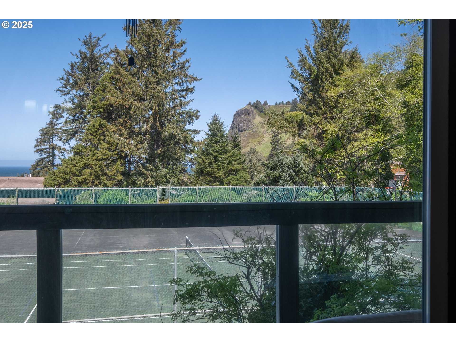 301 Otter Crest Loop, Unit 174/175 Otter Rock, OR 97369 - Photo 23 of 46 a view of backyard from window