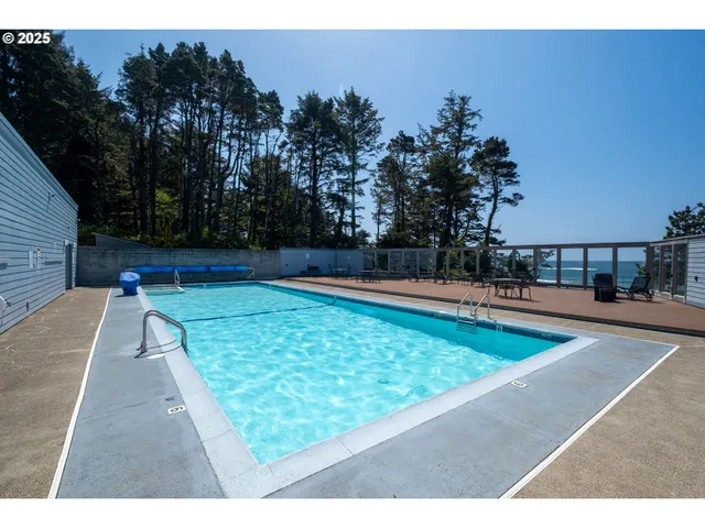a view of a swimming pool with a lounge chair