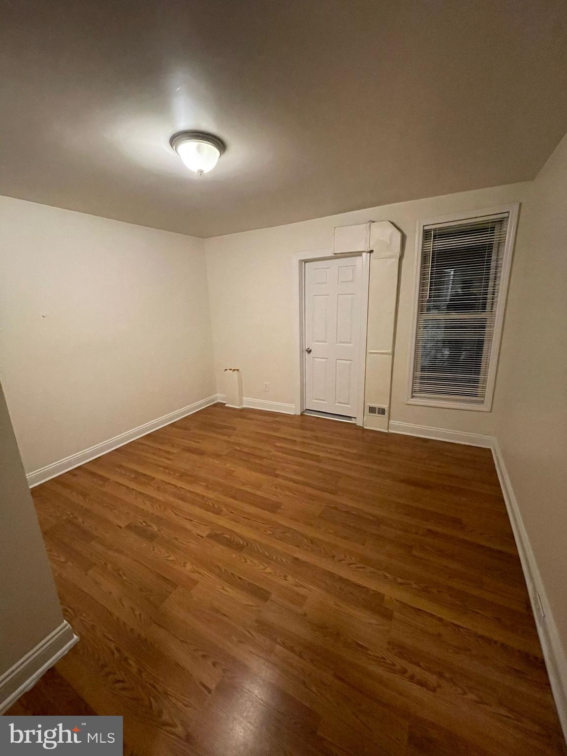 202 Harmison Street Baltimore, MD 21223 - Photo 8 of 16 wooden floor in an empty room