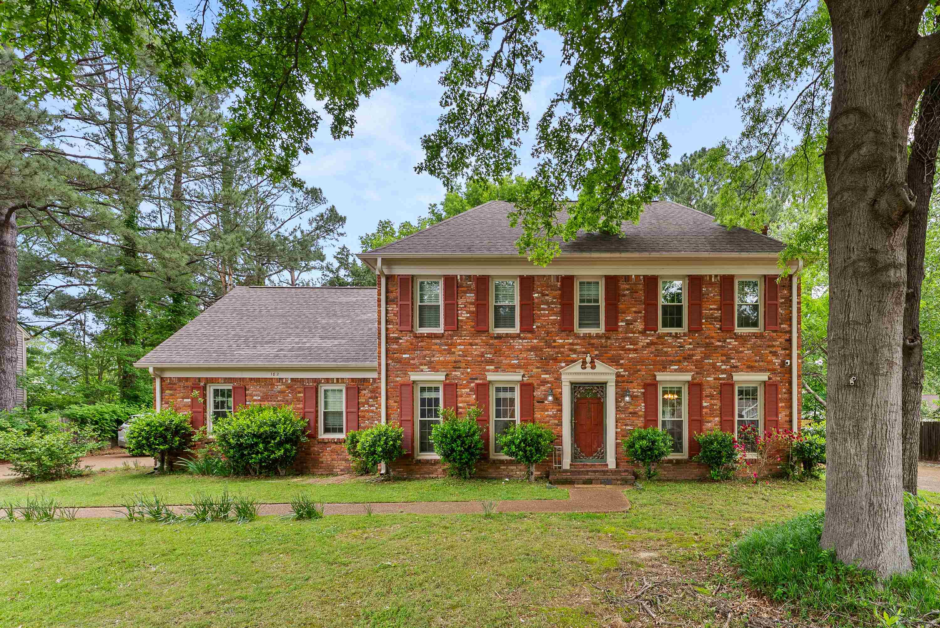 a front view of a house with a yard
