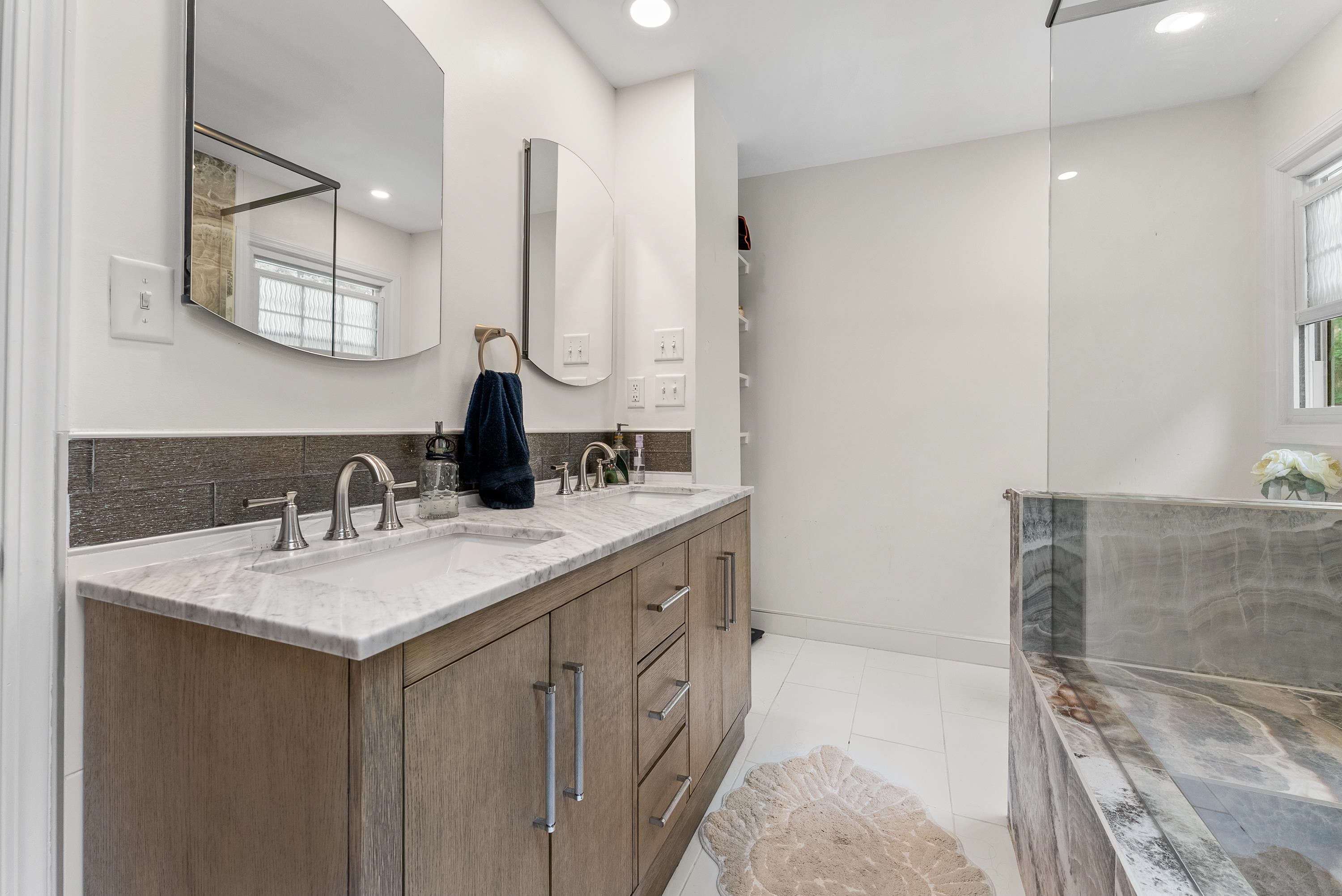 182 East Powell Road Collierville, TN 38017 - Photo 11 of 21 a bathroom with a granite countertop sink and a mirror