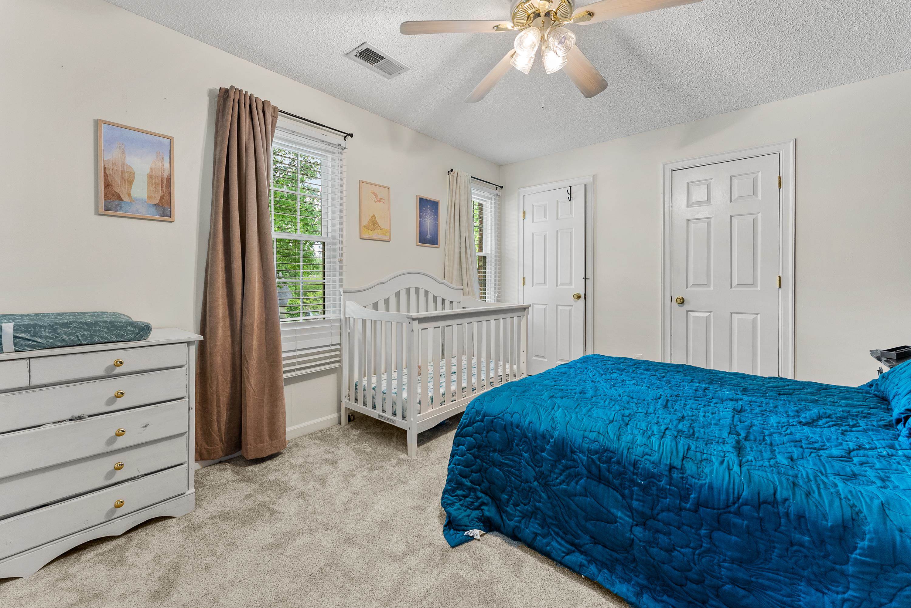 182 East Powell Road Collierville, TN 38017 - Photo 12 of 21 a bedroom with a bed and a baby crib