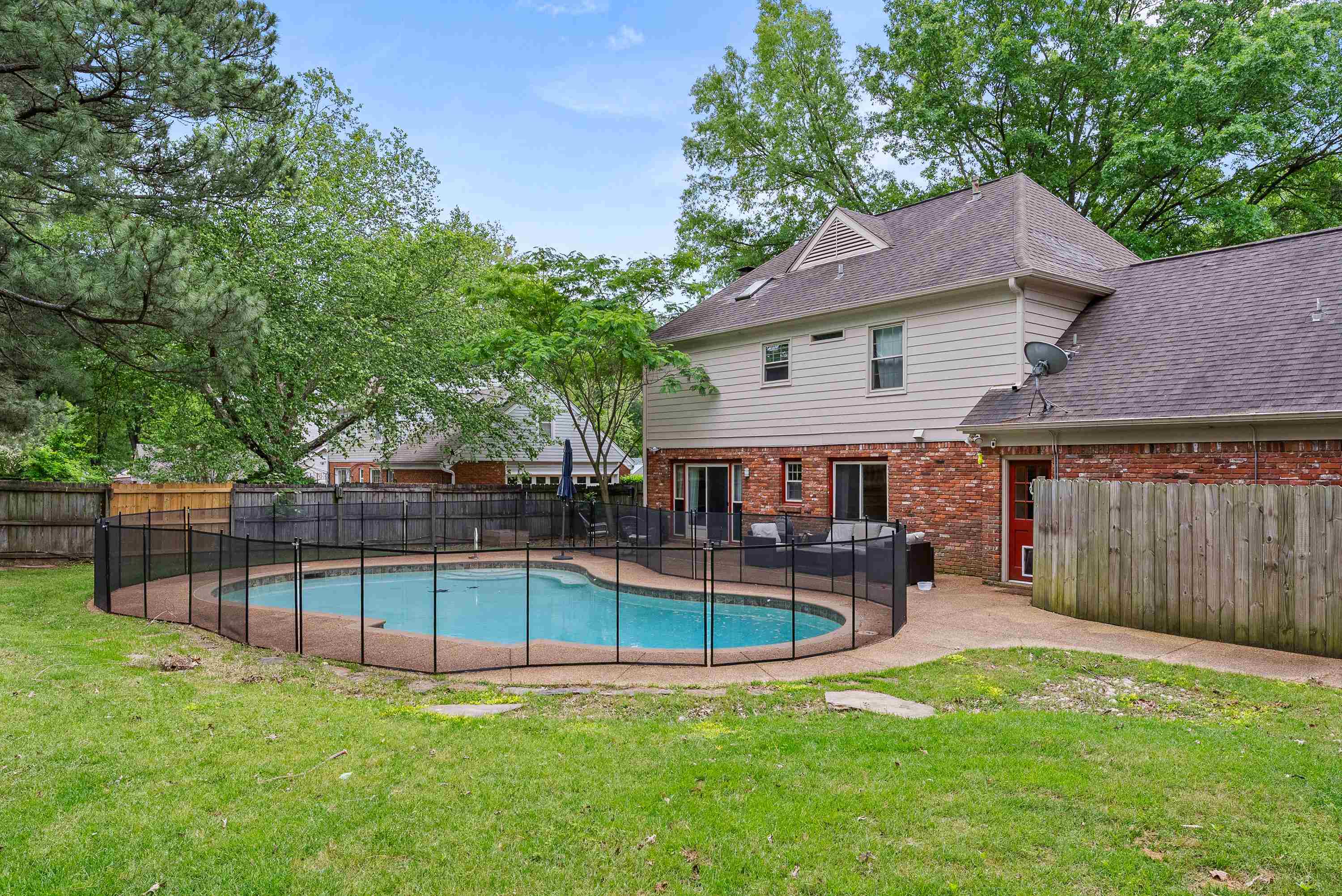 182 East Powell Road Collierville, TN 38017 - Photo 16 of 21 a view of a house with roof deck and a backyard