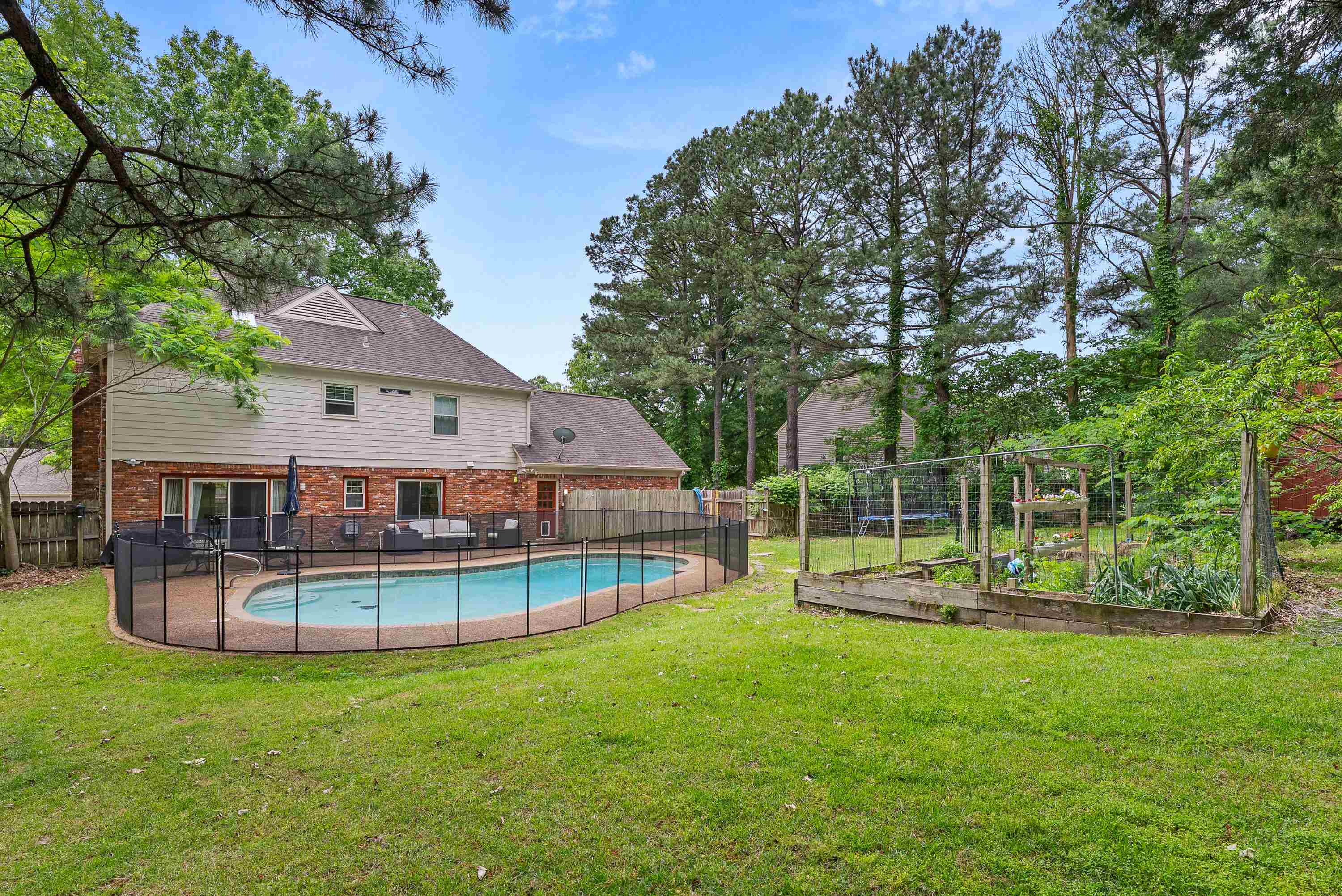 182 East Powell Road Collierville, TN 38017 - Photo 17 of 21 a view of a house with a backyard and a slide