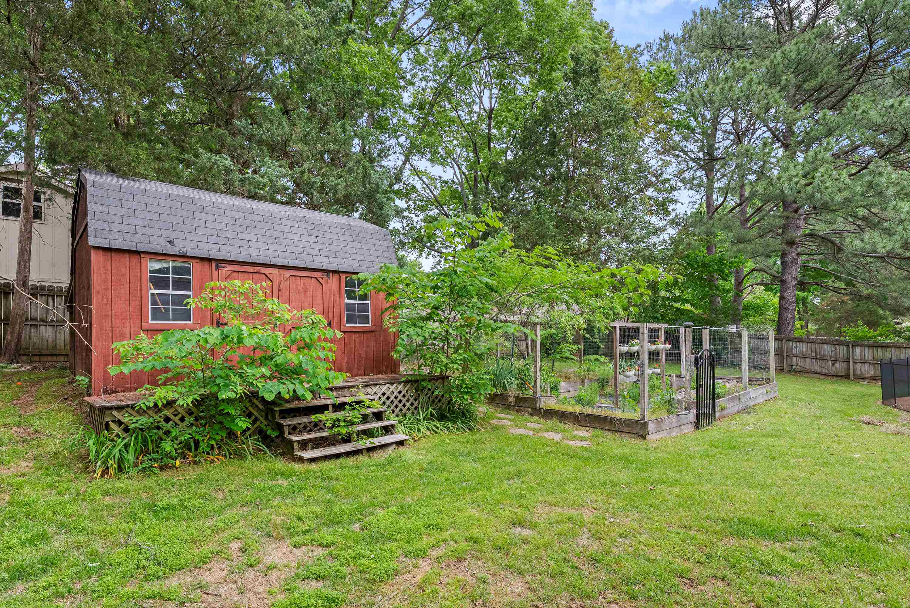 182 East Powell Road Collierville, TN 38017 - Photo 19 of 21 a view of a house with backyard and a slide