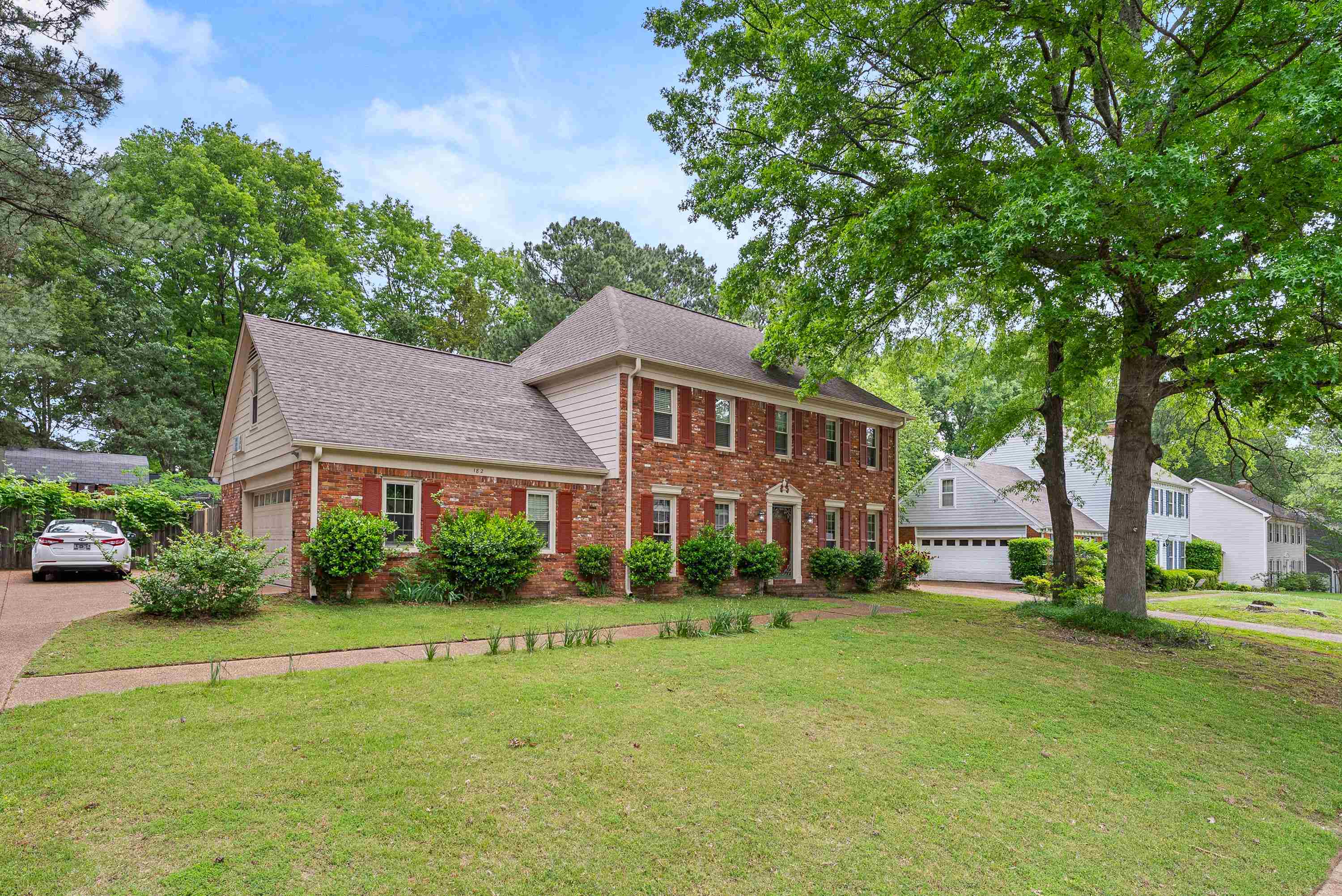 182 East Powell Road Collierville, TN 38017 - Photo 2 of 21 a front view of house with yard and green space