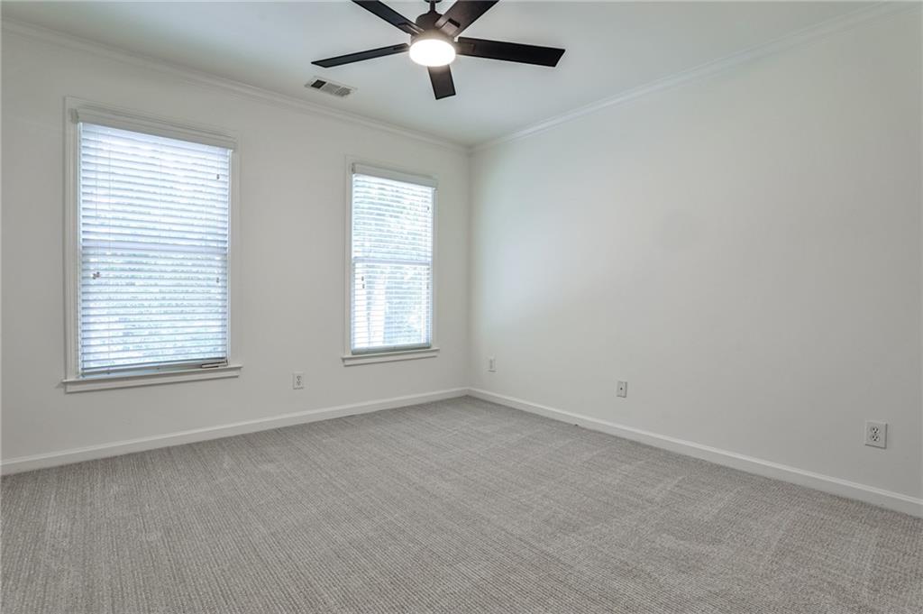 1621 Duncan Drive Northwest Atlanta, GA 30318 - Photo 24 of 53 an empty room with a window and a fan