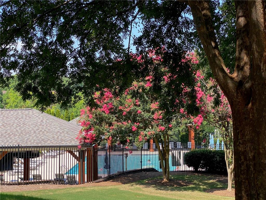 1621 Duncan Drive Northwest Atlanta, GA 30318 - Photo 37 of 53 a front view of a house with a garden and tree