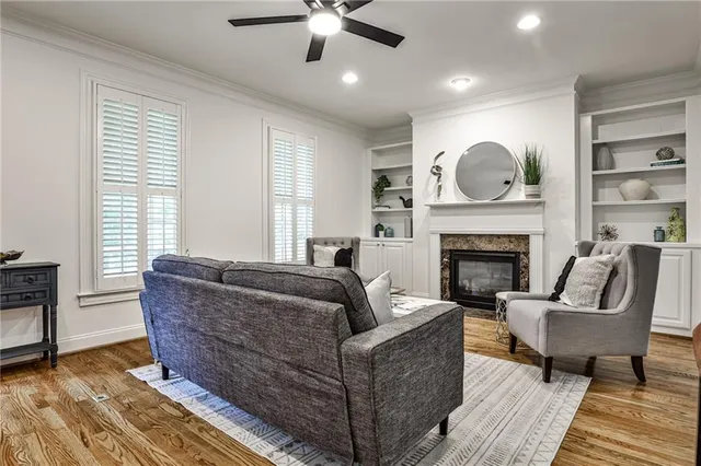 a living room with furniture and a fireplace