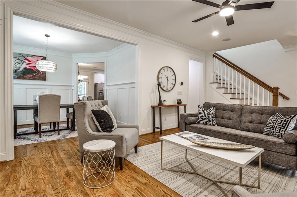1621 Duncan Drive Northwest Atlanta, GA 30318 - Photo 6 of 53 a living room with furniture a rug and a clock