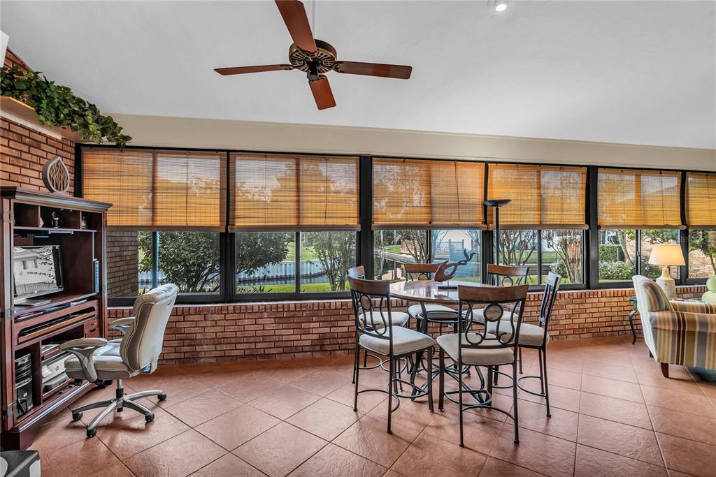 104 Acacia Point Yalaha, FL 34797 - Photo 14 of 83 a view of a dining room with furniture window and outside view