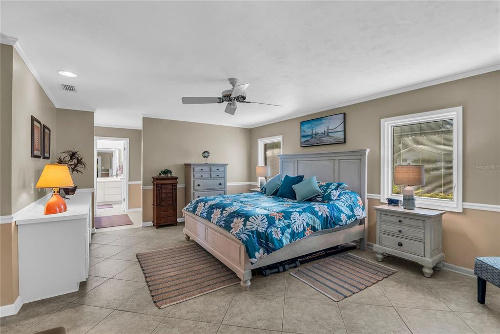 104 Acacia Point Yalaha, FL 34797 - Photo 18 of 83 a bed room with a bed and window