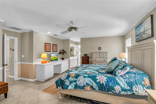 a view of a livingroom with workspace and a window