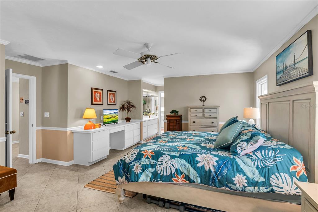 104 Acacia Point Yalaha, FL 34797 - Photo 20 of 83 a bed room with a bed window and a television