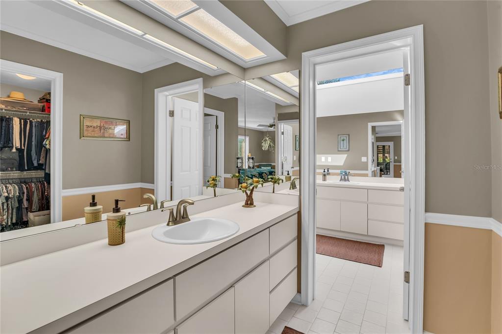 104 Acacia Point Yalaha, FL 34797 - Photo 21 of 83 a bathroom with a sink and a mirror