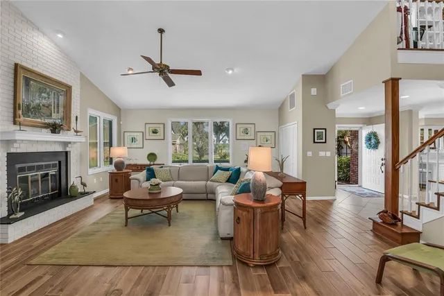 a living room with furniture and a fireplace
