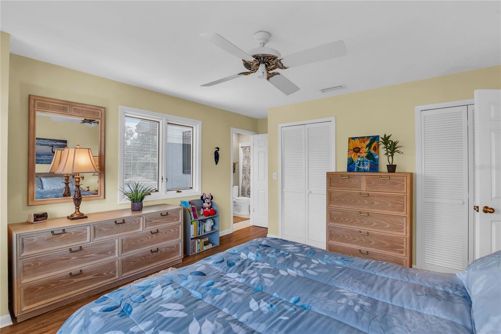 104 Acacia Point Yalaha, FL 34797 - Photo 39 of 83 a bed room with a bed and a view of bedroom