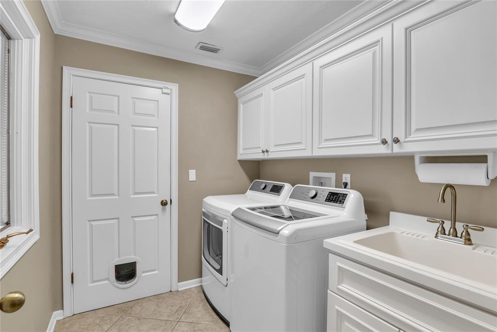 104 Acacia Point Yalaha, FL 34797 - Photo 44 of 83 a utility room with dryer and washer