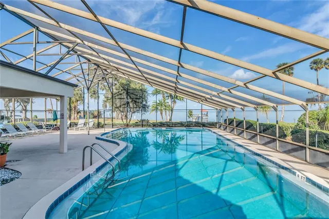 an aerial view of house with yard swimming pool and outdoor seating