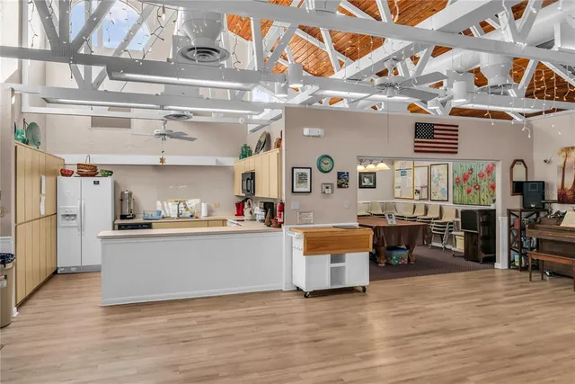an aerial view of house with yard swimming pool and outdoor seating