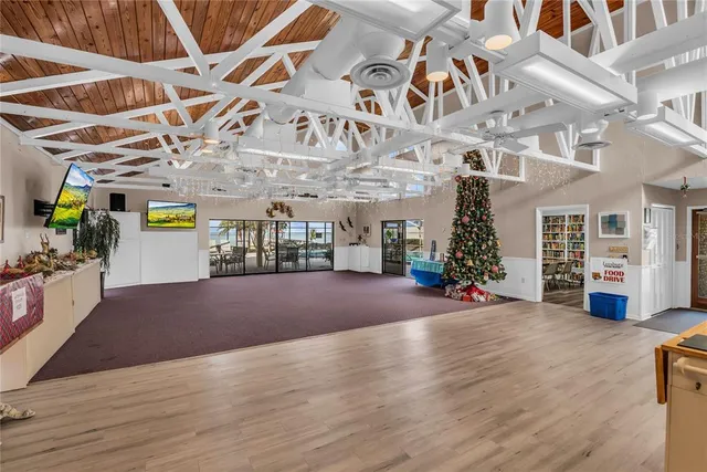 an aerial view of a house with a swimming pool yard and outdoor seating