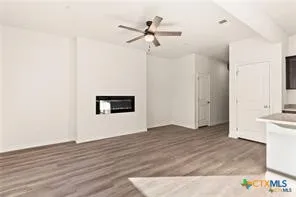 a view of an empty room with a window