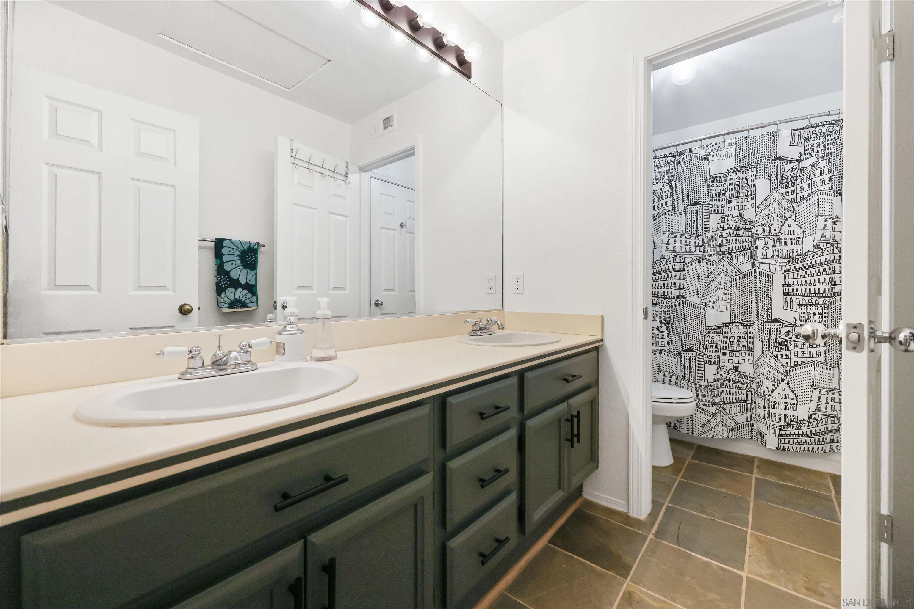 2457 Victoria Circle Alpine, CA 91901 - Photo 18 of 40 a bathroom with a double vanity sink and a mirror