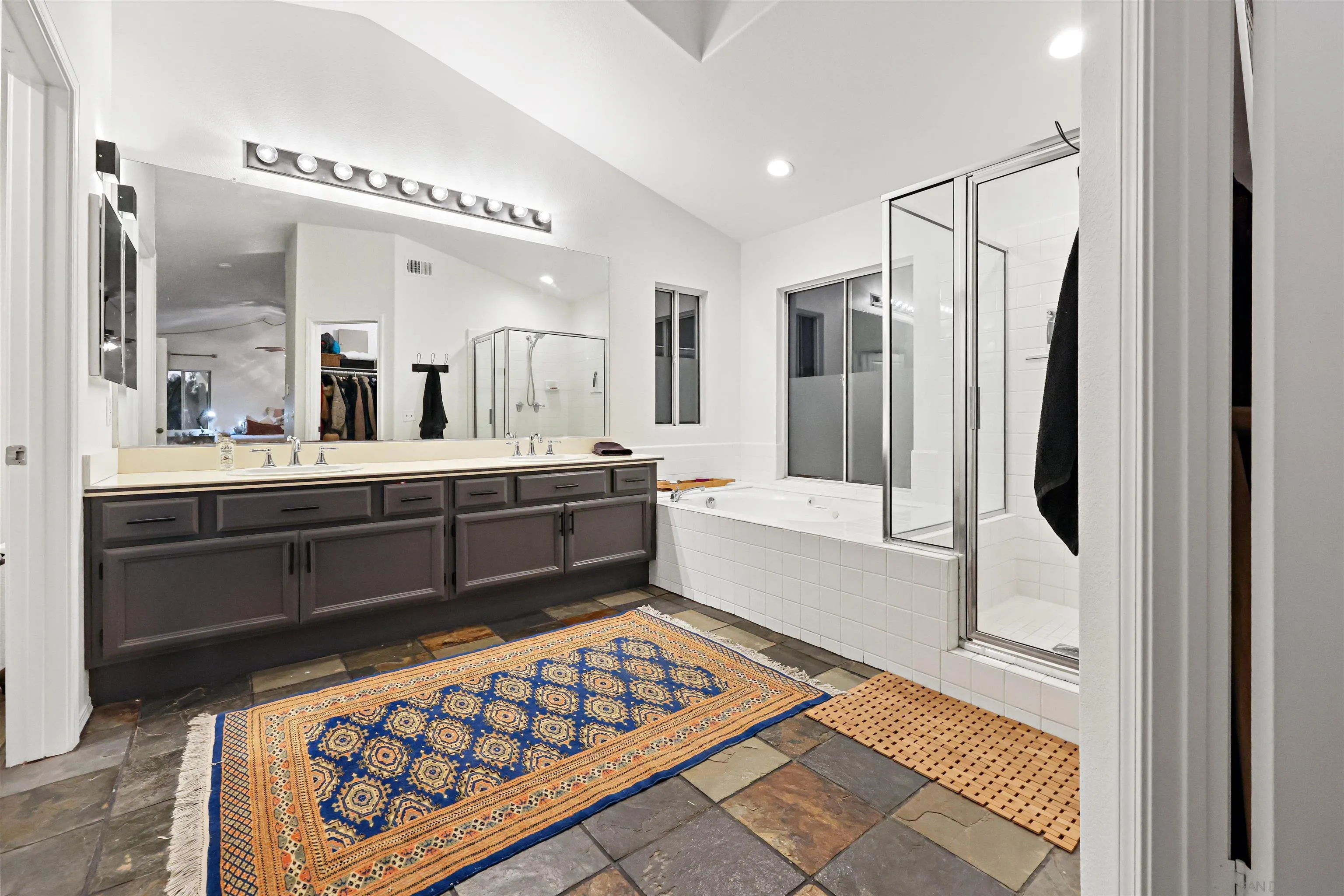 2457 Victoria Circle Alpine, CA 91901 - Photo 23 of 40 a bathroom with a double vanity sink mirror and bathtub