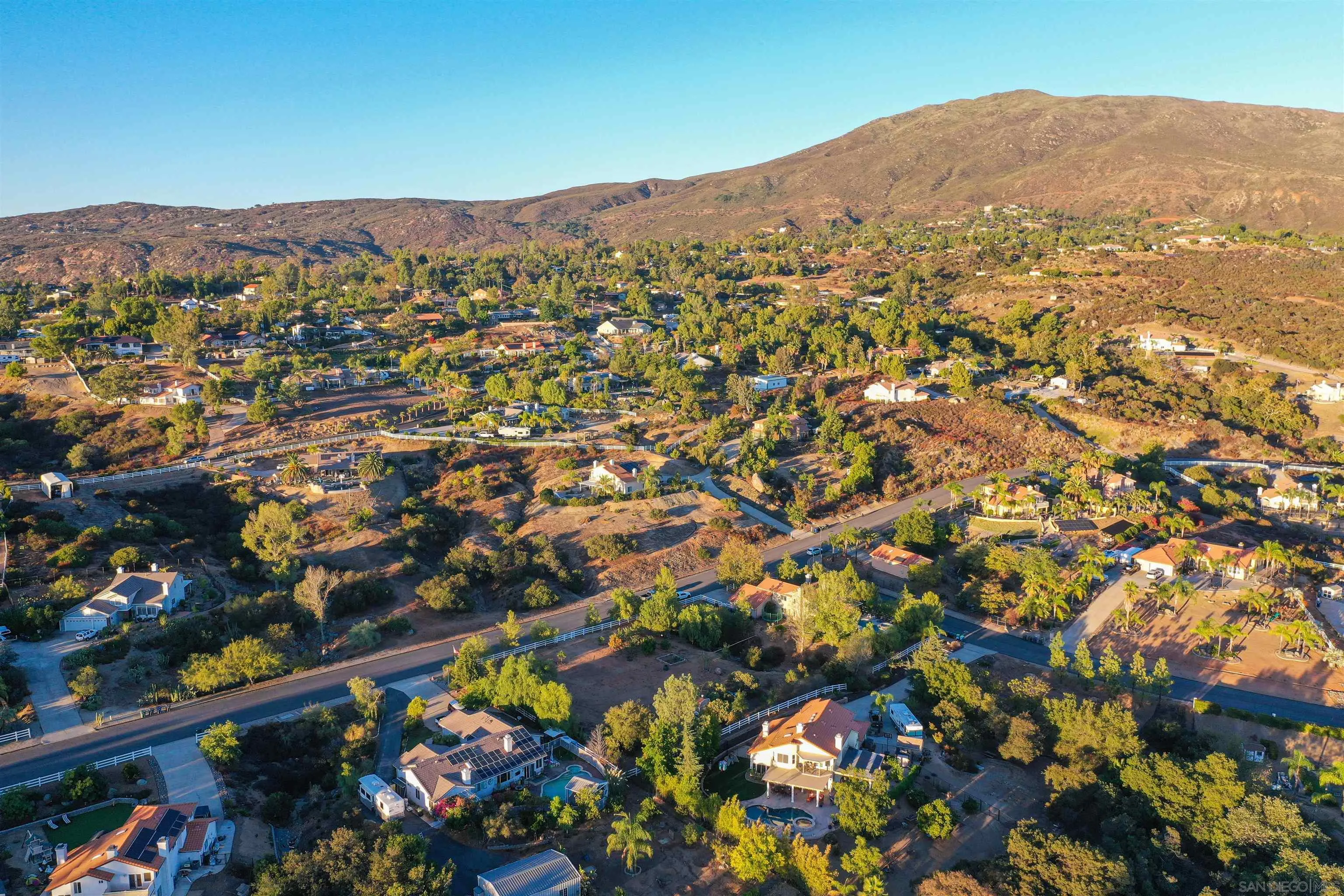 2457 Victoria Circle Alpine, CA 91901 - Photo 37 of 40 an aerial view of residential houses with street and mountain view in back