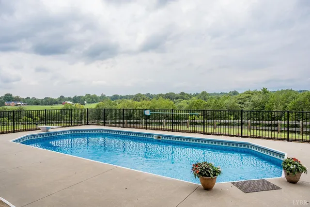 a view of a terrace with yard and mountain view in back