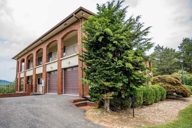 a kitchen with stainless steel appliances granite countertop a sink and a refrigerator