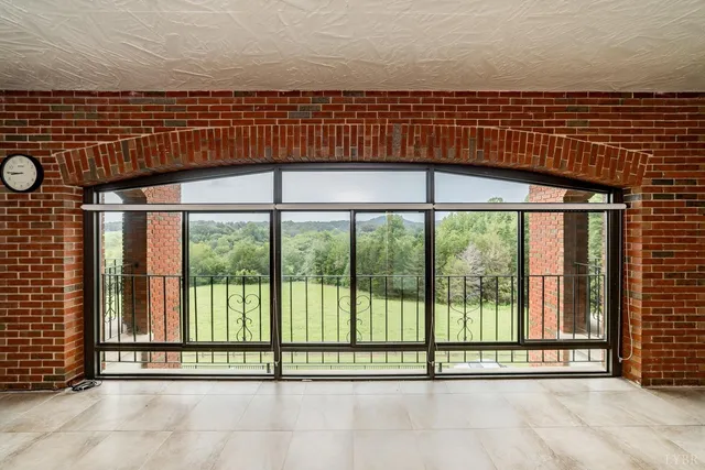 a view of livingroom with furniture and a large window