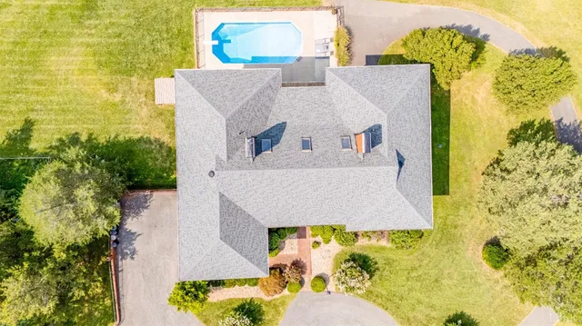 a view of a park with large trees