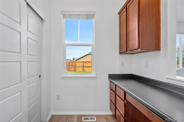 a view of an empty room with wooden walls